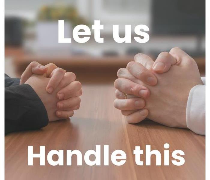 Hands of two people on a table