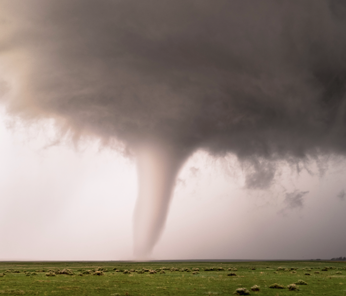 A tornado in a field. 