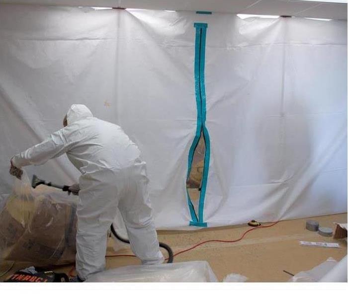 Technician wearing a PPE for a a mold remediation